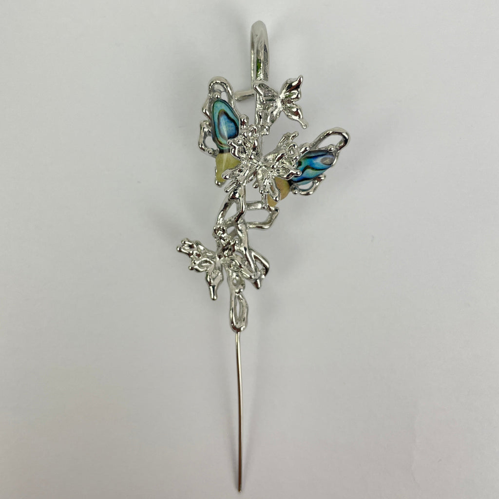 Silver bracelet with blue stones on a white background